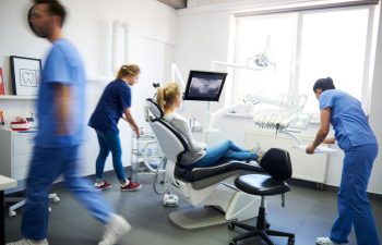 A female patient in a dental chair at an emergency dentist's office